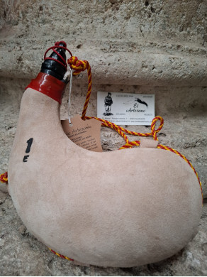 BOTA VINO DE PEZ CURVA 1 LITRO CLARA PIEL DE CABRA